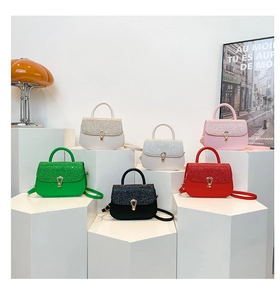 Collection of mini sequin crossbody bags in six vibrant colors with metallic buckles