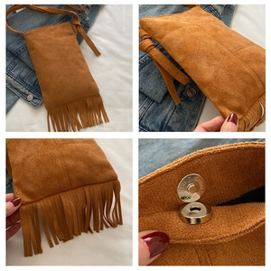Detail shot of brown suede crossbody bag with long fringes and magnetic metal closure