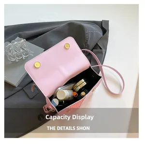 Internal view of pink crossbody bag showing spacious capacity for phone and cosmetics
