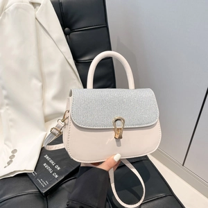 Minimalist white leather crossbody bag with sparkling crystal flap and golden U-shaped lock