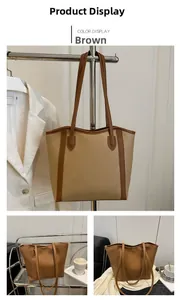 Detail view of the brown large capacity PU tote bag showing sleek design and texture