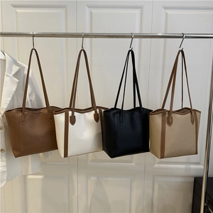 Minimalist large contrast tote bags in brown, cream, and black for daily commute