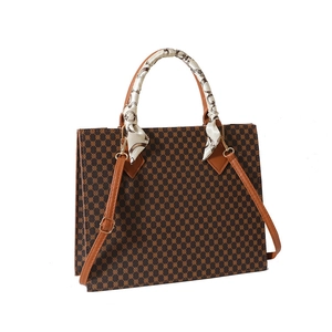 Retro geometric tote bag with scarf-wrapped handle and leather shoulder strap