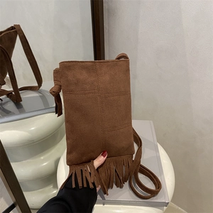 Brown faux suede tassel crossbody bag with knot detail for casual summer styling