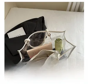 Detailed view of large transparent PVC tote bag interior with heavy-duty rope handle