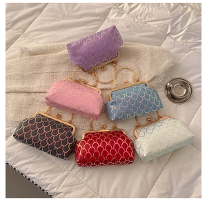 Detailed top view of vintage metallic clasp bags in six colors with chain handles