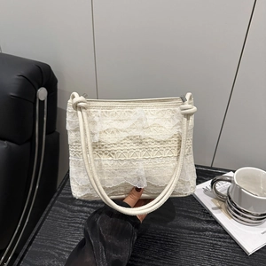 Elegant off-white lace crossbody bag with layered frills and silver hardware details