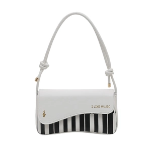 Minimalist white shoulder bag with piano key pattern and I Like Music gold lettering