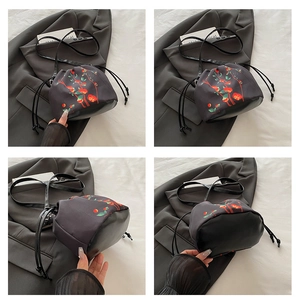 Multi-angle view of vintage bucket bag with red floral prints and leather base