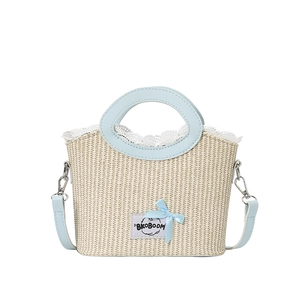 Woven basket bag with blue ribbon bow and lace trim detail for summer fashion