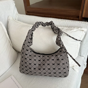 Minimalist black and white gingham tote bag with bow patterns and ruched handles
