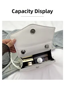 Internal capacity of the white bow-knot handbag showing storage for cosmetics