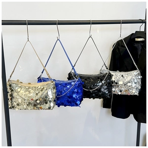 Macro shot of sequin shoulder bags in gold, blue, black, and silver with chain details