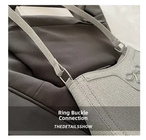 Close-up of the metal ring buckle connecting the silver glitter strap and the bag