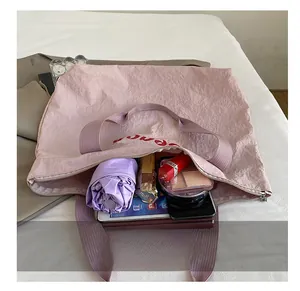 Internal view of pink tote bag showing large capacity for tablet and cosmetics