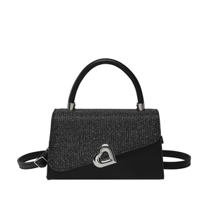 Elegant black two-tone shoulder bag featuring glitter flap and silver heart metal buckle