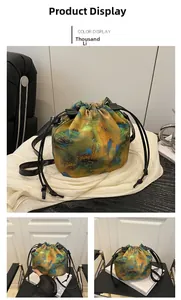 Detail of drawstring bucket bag with traditional Chinese landscape painting print