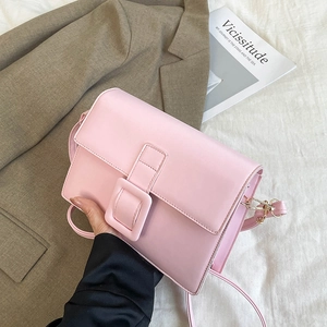 Pink minimalist crossbody bag with square buckle and gold metal hardware for women