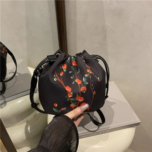 Vintage Xiangyun Silk bucket bag with orange berry pattern and drawstring closure