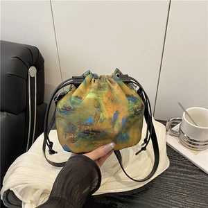 Knitted crossbody bucket bag with traditional oriental landscape embroidery and drawstrings