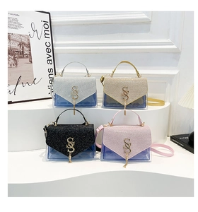 Detail of four glitter PVC handbags with golden S-buckle on a white display stand