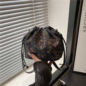 Vintage floral Xiangyun silk bucket bag with drawstring closure and crossbody strap