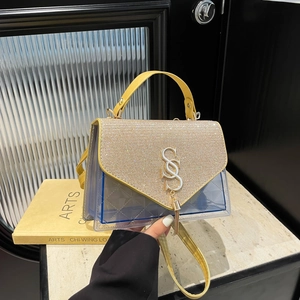Fashionable quilted blue PVC shoulder bag with sparkling gold sequins and metal logo