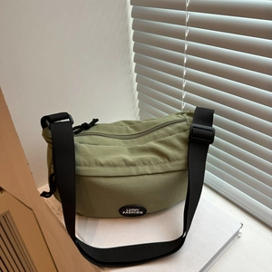 Olive green nylon crescent shoulder bag with adjustable strap and Lucky Fashion logo