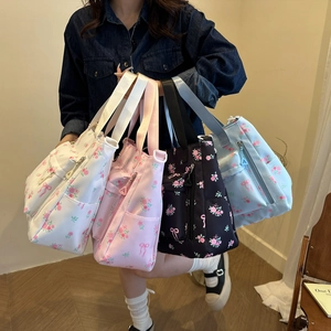 Floral canvas tote bags shown in four colors with multiple pockets and cute bow patterns