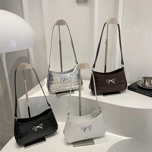 Chic stone-embossed underarm bags in four colors with metallic butterfly bow decor