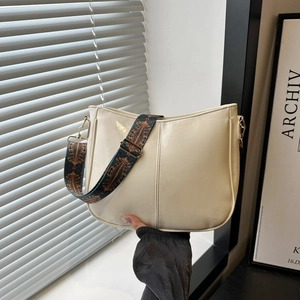 Chic cream faux leather tote bag featuring a vintage ethnic woven wide shoulder strap