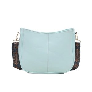 Minimalist light blue crescent crossbody bag with ethnic style patterned wide strap