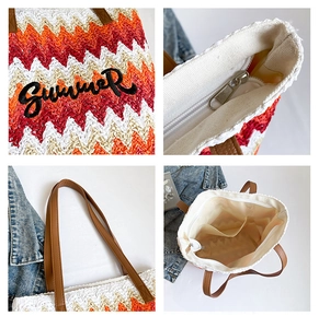 Detail of woven tote bag with Summer embroidery, zipper closure, and inner pocket