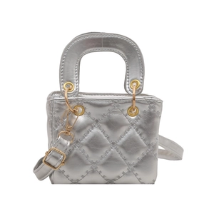 Silver quilted mini top-handle bag with a metallic finish and detachable strap