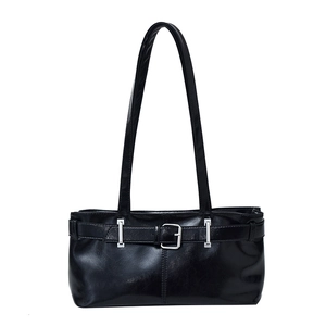 Glossy black vintage baguette bag with dual shoulder straps and decorative silver buckle