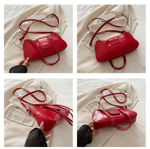 Detail view of glossy red patent leather shoulder bag with GAIDENIANBAG branding logo
