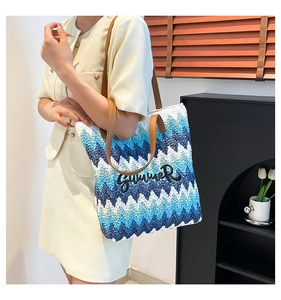 Detail of hand-woven tote bag featuring chevron patterns and 3D Summer embroidery