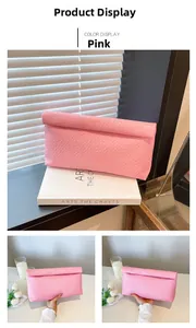 Close-up of pink woven texture envelope clutch bag with detailed rectangular pattern