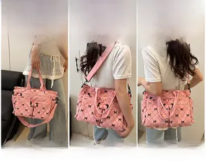Pink corduroy makeup bag with bow pattern and dual front zipper pockets detail