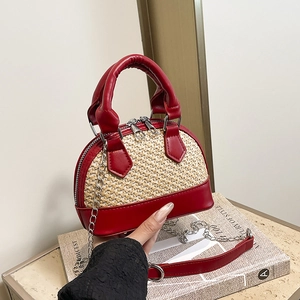 Mini bicolor shell bag in red leather and straw weave with a chain shoulder strap
