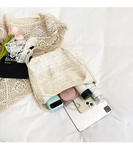 Internal view of cream lace tote bag showing spacious capacity for tablets and cosmetics
