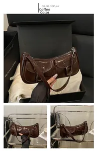 Detailed view of the dark coffee vintage handbag with silver buckles and retro pockets