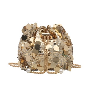 Elegant gold sequin bucket bag with luxury metallic chain strap and pearl drawstring detail