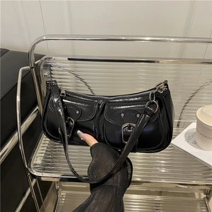 Glossy black underarm bag with double front pockets and silver buckle accents