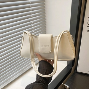 Cream-colored PU leather baguette shoulder bag with slim straps and brand lettering