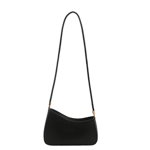 Minimalist black leather underarm bag with asymmetric curved opening and gold square buckles