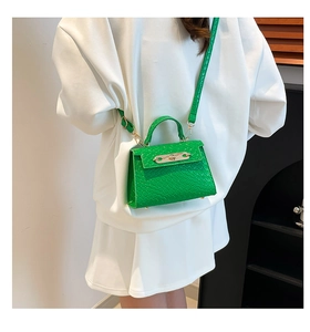 Mini green faux leather crossbody bag with crocodile texture and gold lock hardware