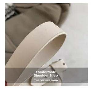 Detailed close-up of cream PU leather shoulder strap with refined stitching and lychee texture