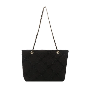 Chic black large capacity tote bag with quilted texture and gold chain shoulder strap