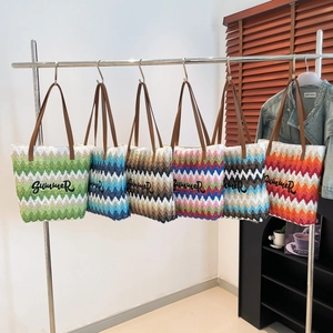 Woven summer tote bag with zigzag patterns and leather handles in multiple colors